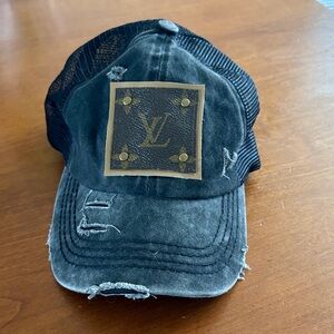 C.C. Boutique Black Distressed Mesh Trucker Hat with Louis Vuitton Patch